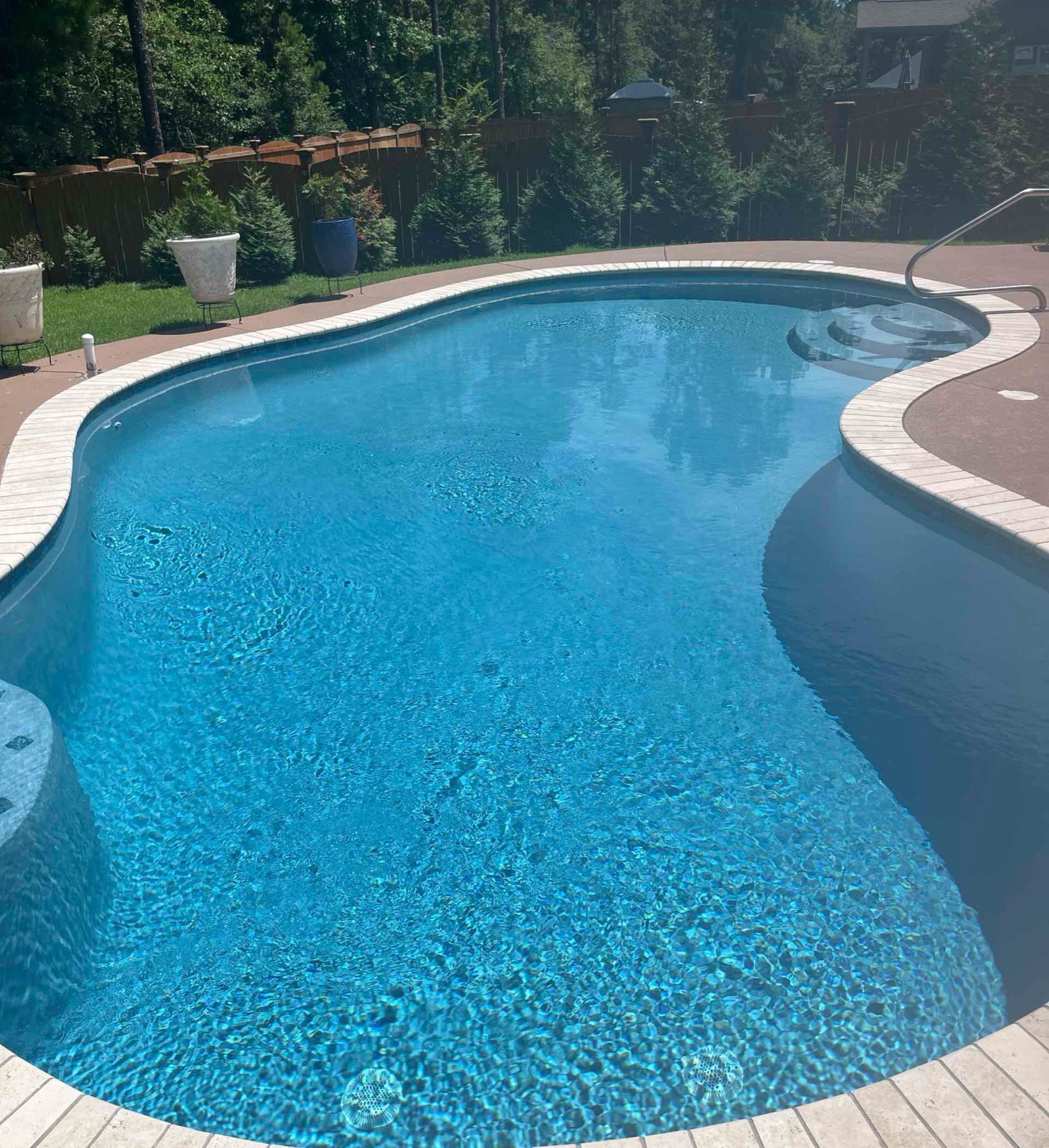 Clear blue residential pool after service.