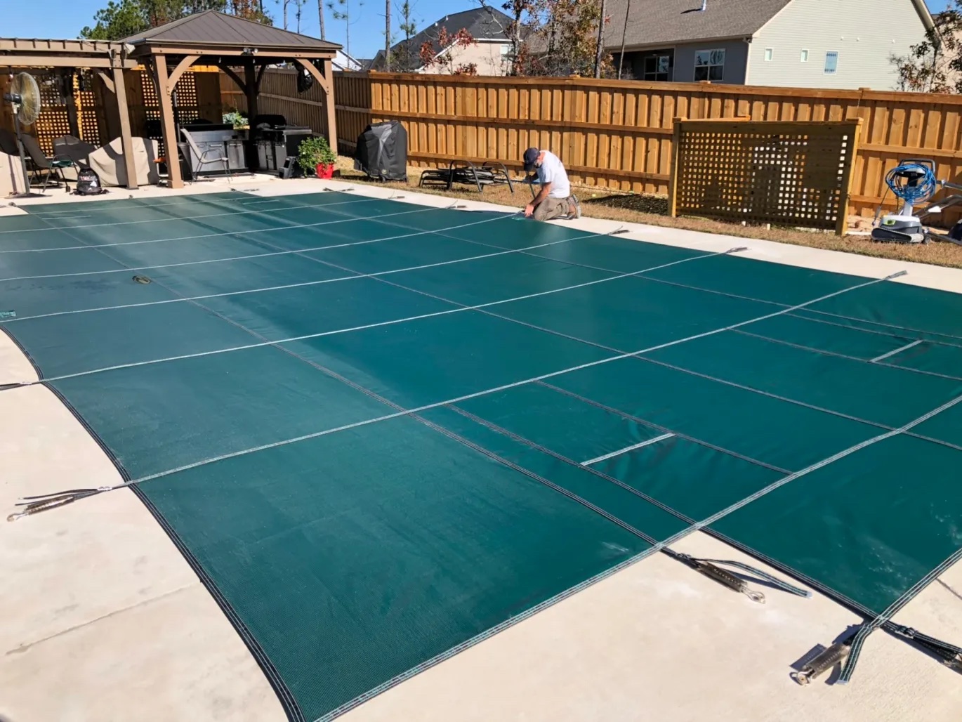 Custom pool safety cover measure and installation.
